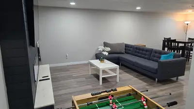 a living room with a couch and a table at Alanas house in Denver