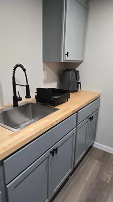a kitchen with a sink and a counter top at Alanas house in Denver