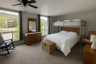 a bedroom with a bed and a dresser and a fan at Dillon Valley Mountain Escape in Dillon