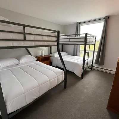 two bunk beds in a room with a window at Dillon Valley Mountain Escape in Dillon