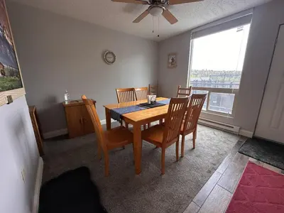 a dining room with a table and chairs and a window at Dillon Valley Mountain Escape in Dillon