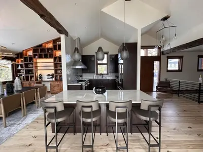 a kitchen with a table and chairs in a room at Serenity at Sherwood - Mid Term Rental in Breckenridge
