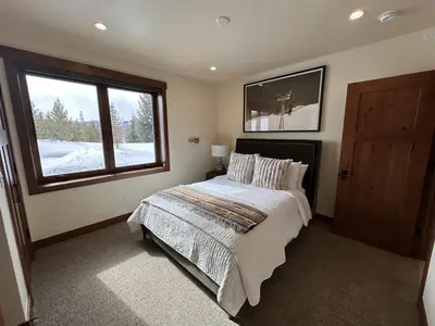 a bedroom with a large bed and a window at Serenity at Sherwood - Mid Term Rental in Breckenridge