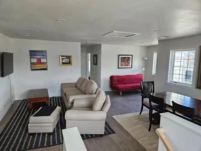 a living room with a couch and a table at Sunny Beautiful Apt, 2nd Level, 2Bedroom, 2Bath, Kitchen, Dining in Denver