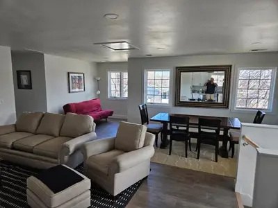 a living room with a couch and a table at Sunny Beautiful Apt, 2nd Level, 2Bedroom, 2Bath, Kitchen, Dining in Denver