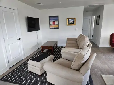 a living room with two couches and a table at Sunny Beautiful Apt, 2nd Level, 2Bedroom, 2Bath, Kitchen, Dining in Denver