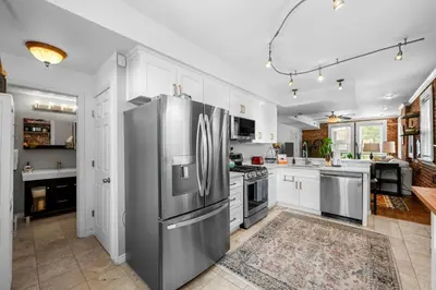 a large kitchen with a stainless steel refrigerator at 1438 Franklin Unit 210 in Denver