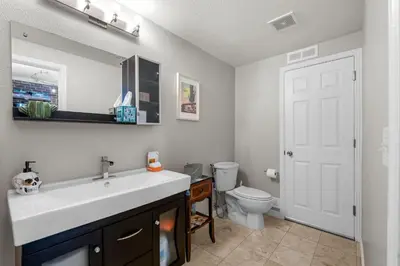 a bathroom with a white sink and a toilet at 1438 Franklin Unit 210 in Denver