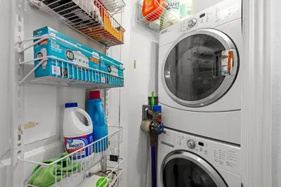 a laundry room with a washer and dryer at 1438 Franklin Unit 210 in Denver
