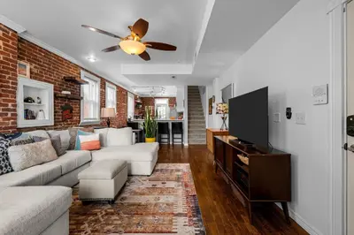 a living room with a couch and a ceiling fan at 1438 Franklin Unit 210 in Denver