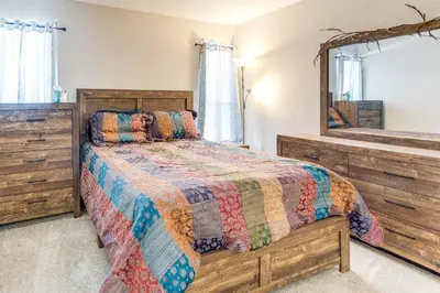 a bedroom with a bed and a mirror at 8 Mi to Dtwn Denver Groovy Pet-Friendly Condo in Denver