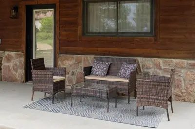 a porch with chairs and a couch and a table at Pet Friendly, 4 Bedrooms Plus Game Room, Easy Walk to Lake Granby & Beacon Landing Marina in Grand Lake