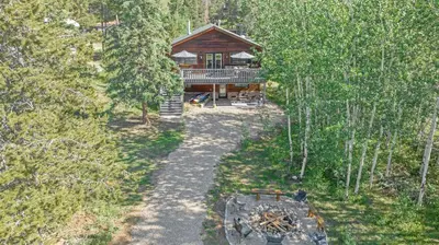 an overhead view of a log cabin in the woods at Pet Friendly, 4 Bedrooms Plus Game Room, Easy Walk to Lake Granby & Beacon Landing Marina in Grand Lake
