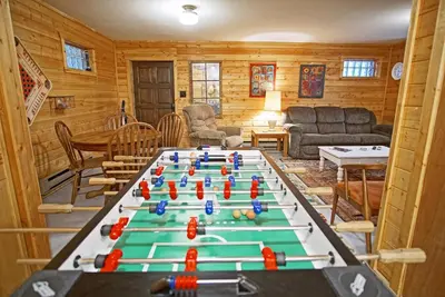 a living room with a pool table in the middle of it at Large Wraparound Deck, Foosball Table, Close to Beacon Landing Marina in Grand Lake