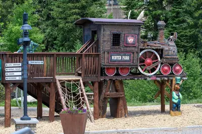 a small train on a playground in a park at Beaver Village 1712 - Nicely Updated, 2 Queens Plus 2 Twins, Pool, Hot Tubs, Sauna in Winter Park