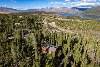 an aerial view of a house surrounded by trees at Outdoor Dining and Firepit, Pet Friendly, Breathtaking Views, High End Cabin in Grand Lake