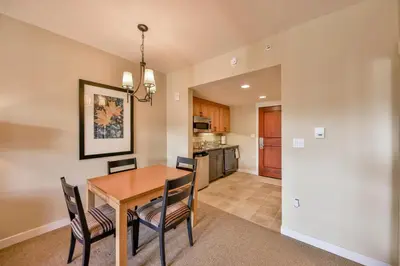 a dining room and kitchen with a table and chairs at Pool, Hot Tub, Ski In Ski Out, Bike Storage for Summer Guests in Winter Park