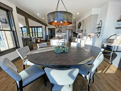 a kitchen and dining room with a table and chairs at Luxury Home, Game Room, Outdoor Fireplace, Amazing Views in Grand Lake