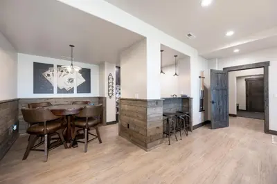 a kitchen and dining room with a table and chairs at Luxury Home, Game Room, Outdoor Fireplace, Amazing Views in Grand Lake