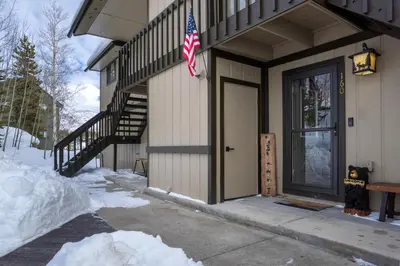 a house with a flag on the side of it at Lula in Grand Lake