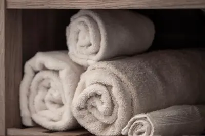 a pile of towels sitting on a shelf at Outdoor Pool, Fireplace, Athletic Club, Covered Balcony with Views in Fraser