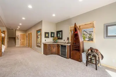 a room with a kitchen with a sink and a stove at Incredible Views, Hiking from the Property, 4 Ensuite Baths, Luxury Home in Grand Lake