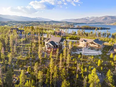 an aerial view of a home with a lake at Incredible Views, Hiking from the Property, 4 Ensuite Baths, Luxury Home in Grand Lake