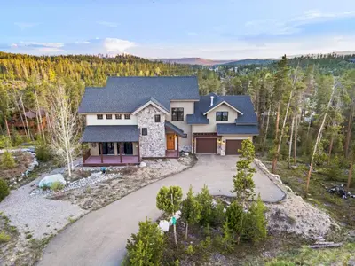 an aerial view of a house with a driveway at Incredible Views, Hiking from the Property, 4 Ensuite Baths, Luxury Home in Grand Lake