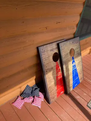 two ties sticking out of a wooden door at Pet Friendly - Cozy & Modern Cabin - Surrounded by Nature in Grand Lake
