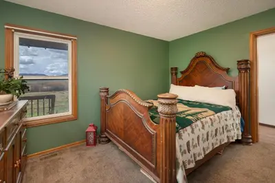 a bedroom with a bed and a window at Pet Friendly - Cozy & Modern Cabin - Surrounded by Nature in Grand Lake