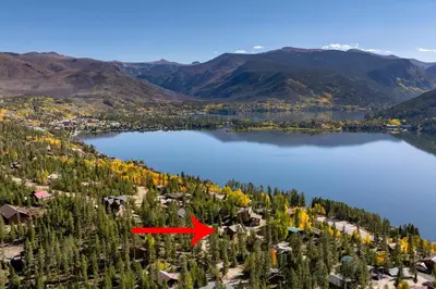 an aerial view of a lake with a red arrow at Spacious Cabin - Quality Finishes & Furniture, 2 Large Bedroom Suites Plus Den Bedroom Suite in Grand Lake