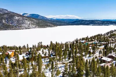 an aerial view of a resort with trees and snow at Spacious Cabin - Quality Finishes & Furniture, 2 Large Bedroom Suites Plus Den Bedroom Suite in Grand Lake