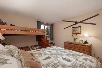 a bedroom with a bunk bed and a dresser at Lakefront Condo, Ground Floor, Ideal for Couples or Families in Grand Lake