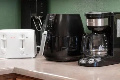 a coffee maker sitting on a counter next to a toaster at Lakefront Condo, Ground Floor, Ideal for Couples or Families in Grand Lake