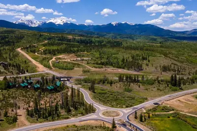 an aerial view of a road with mountains in the background at Private Garage, Washer and Dryer, Amazing Views of Byers Peak, Pet Friendly in Fraser