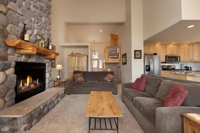 a living room with a couch and a fireplace at Private Garage, Washer and Dryer, Amazing Views of Byers Peak, Pet Friendly in Fraser