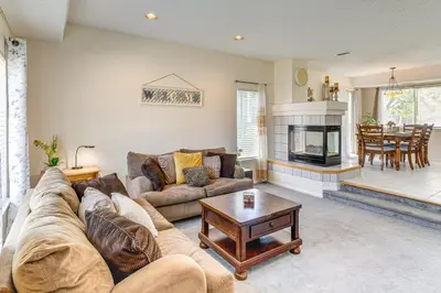 a living room with a couch and a fireplace at Pet-Friendly Retreat with Fenced Yard in Denver in Denver