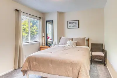 a bedroom with a large bed and a window at Pet-Friendly Retreat with Fenced Yard in Denver in Denver