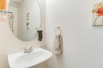 a bathroom with a sink and a mirror at Pet-Friendly Retreat with Fenced Yard in Denver in Denver