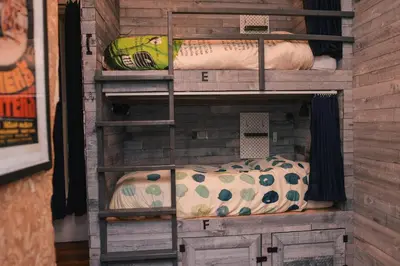 a room with some pillows and a shelf at Hostel Fish in Denver