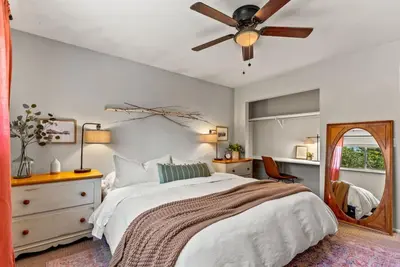 a bedroom with a bed and a ceiling fan at The Gather House Stylish Stay w Room to Play in Westminster