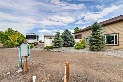 a truck is parked in front of a house at Private Hot Tub and Game Room Keenesburg Getaway! in Hudson