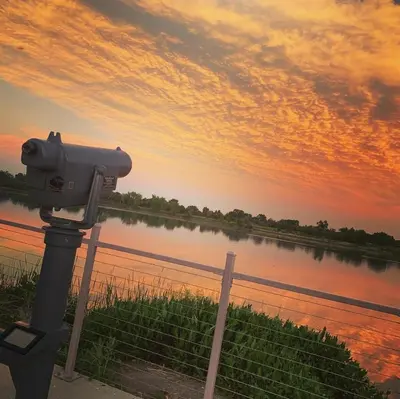 a camera on a pole next to a body of water at Crown Hill Gem - Hot Tub, Yard, Parking in Lakewood