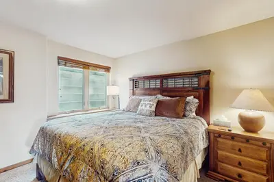 a bedroom with a large bed and a window at View House in Fraser