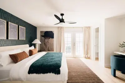 a bedroom with a bed and a ceiling fan at House of Noir Elan Stunning 6BR Designer Retreat in Arvada
