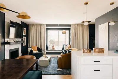 a living room with a couch and a table at House of Noir Elan Stunning 6BR Designer Retreat in Arvada