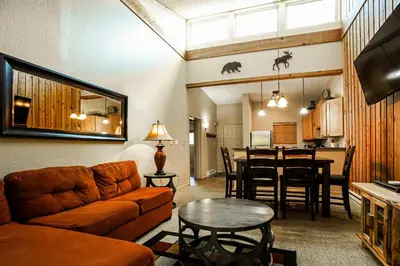 a living room with a couch and a table at Whisk Away to Winter Park 2 BDR 5 Min from Skiing in Winter Park
