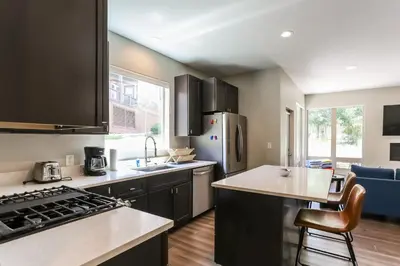 a kitchen with a sink and a stove at Granby Colorful Adventures - Breathtaking Views in Granby