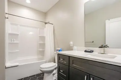 a bathroom with a sink and a toilet and a shower at Granby Colorful Adventures - Breathtaking Views in Granby
