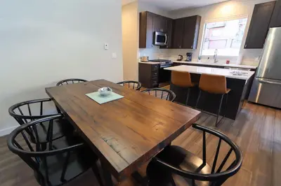 a kitchen with a wooden table and some chairs at Granby Colorful Adventures - Breathtaking Views in Granby